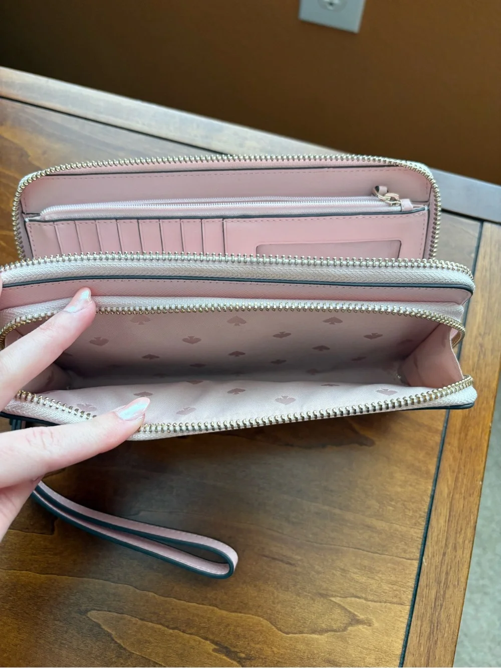 kate spade light pink zip-around wristlet wallet